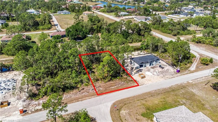 View of property location featuring property boundaries highlighted and a large body of water
