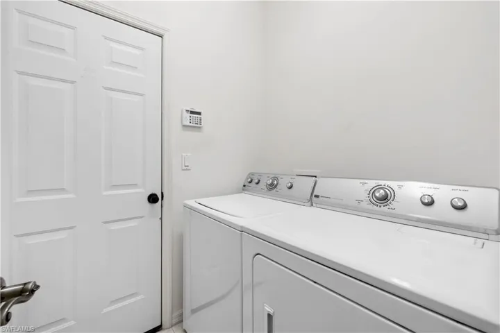 Washroom featuring washer and dryer