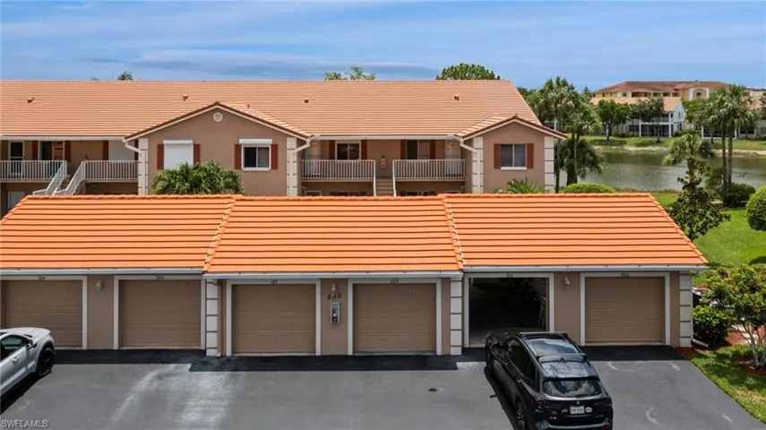 Ranch-style house with a garage and a balcony