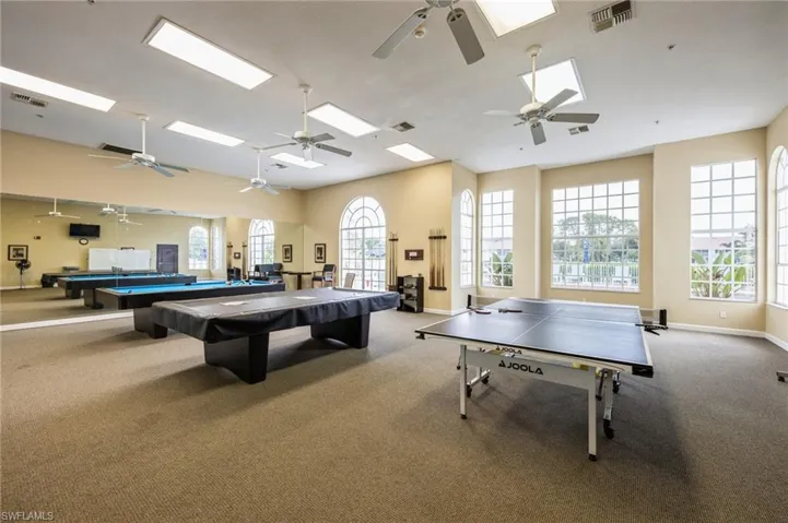 Rec room with a wealth of natural light, billiards, and ceiling fan
