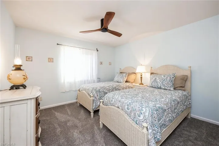 Bedroom with carpet floors and ceiling fan