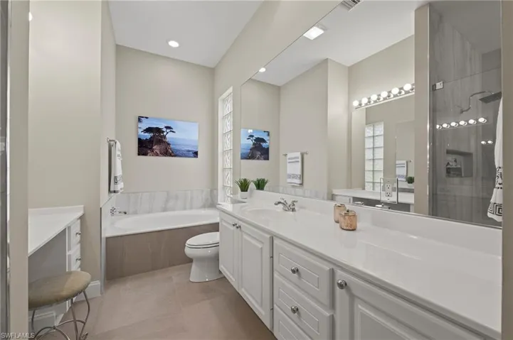 15402 Trevally Way Bonita Springs FL 34135 -  Updated owner's bath with 24. x 24 matte porcelain tile flooring
