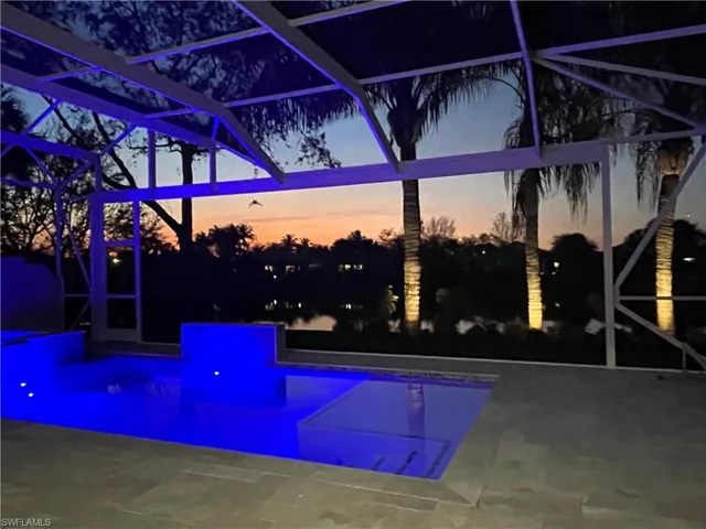 15402 Trevally Way Bonita Springs FL 34135 - Expansive lake view through picture frame cage from lanai