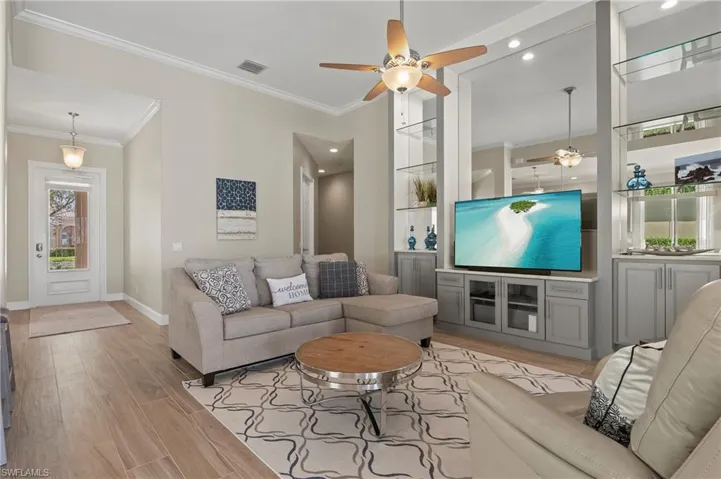 15402 Trevally Way Bonita Springs FL 34135 - Living room with beautiful porcelain tile and updated wall unit