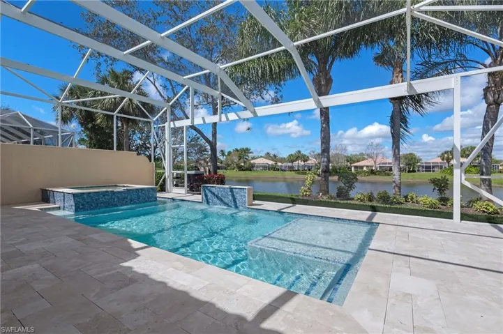 15402 Trevally Way Bonita Springs FL 34135 - Custom pool with sun shelf, spa, and waterfall feature