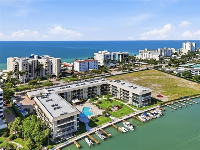 View of urban area featuring a nearby body of water and a marina