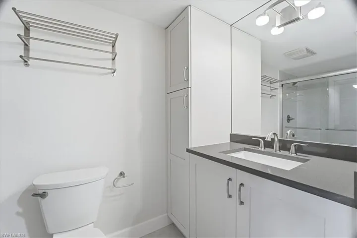 Bathroom featuring vanity and a stall shower