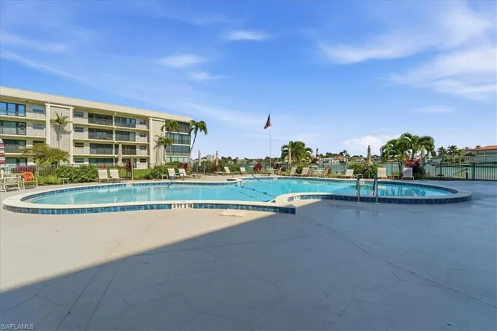 Community pool with a patio area