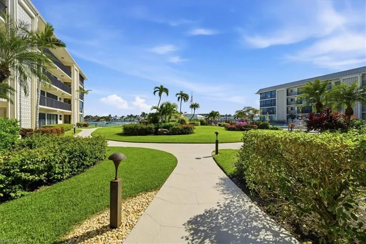View of community featuring a lawn