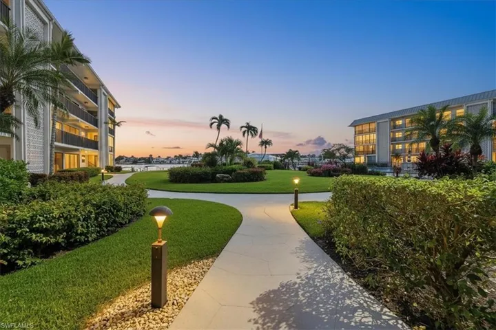 View of community featuring a lawn