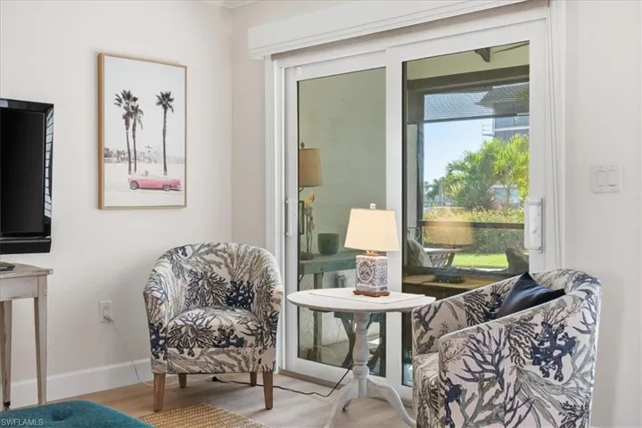 Sitting room featuring wood finished floors and baseboards