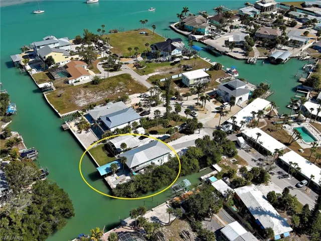 Aerial perspective of suburban area with a nearby body of water