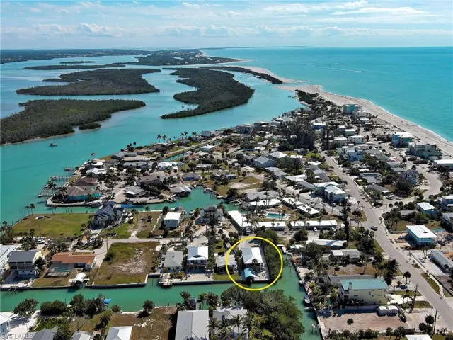 Aerial view of residential area featuring a large body of water