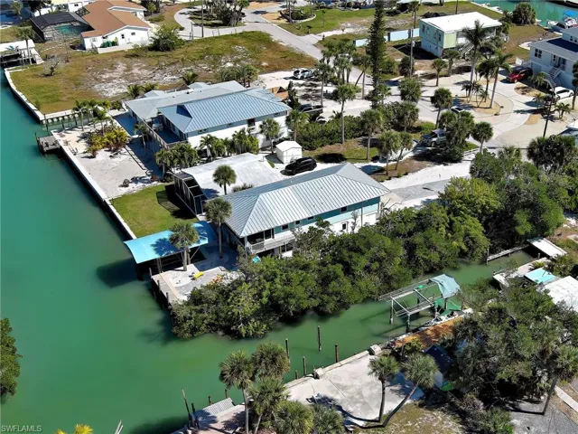 Aerial perspective of suburban area with a large body of water