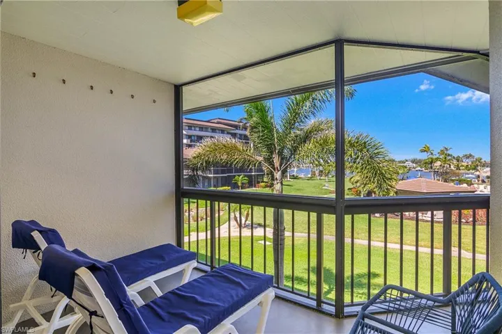 Lanai with plenty of natural light, great bay and pool views.