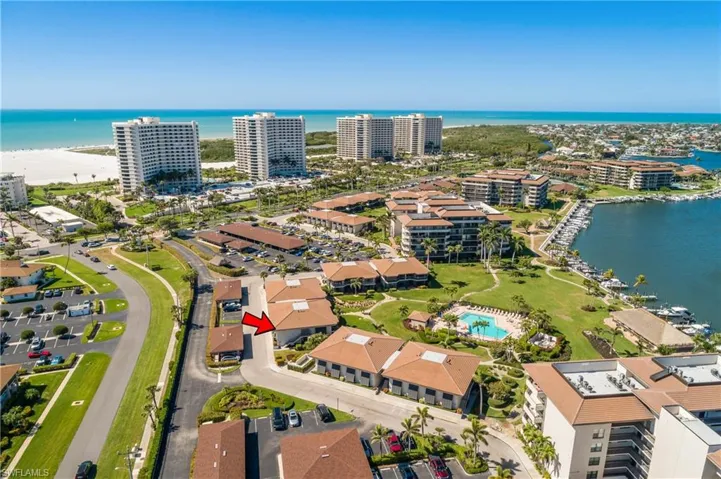 Drone / aerial view featuring a water view. Beach just beyond!