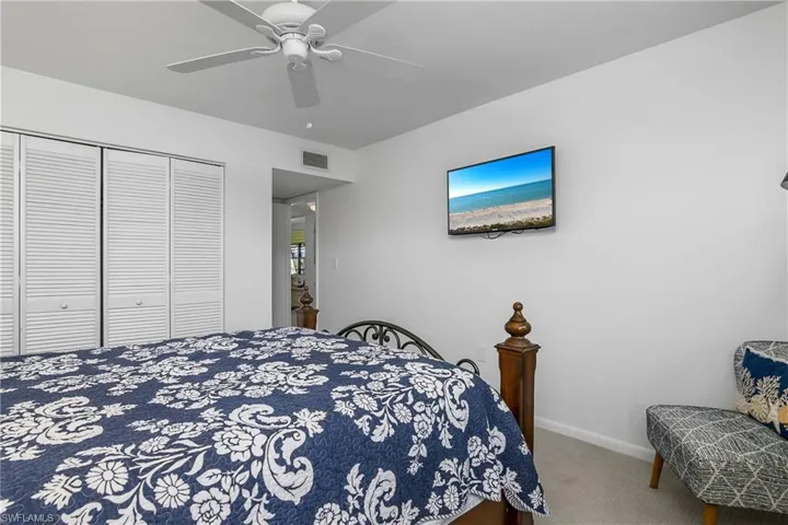 Primary Bedroom featuring ceiling fan, carpet flooring, and a closet