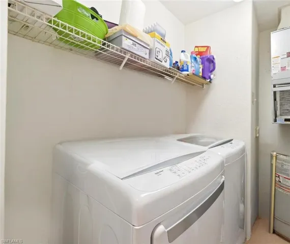 Laundry Room with side-by-side washer and Dryer.