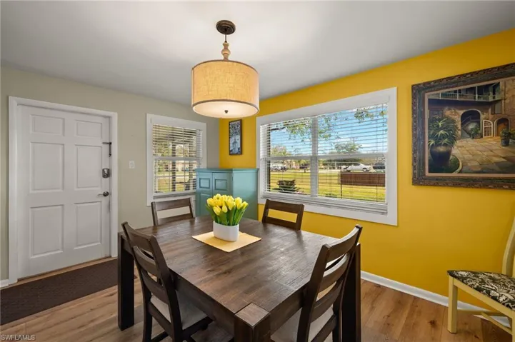Dining room with hardwood / wood-style flooring