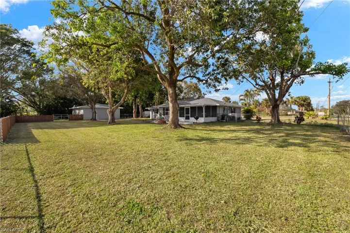 View of yard with a sunroom