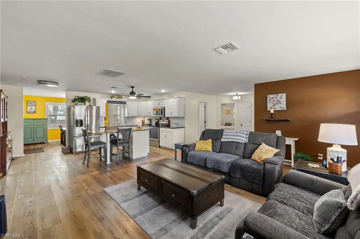 Living room with light hardwood / wood-style flooring