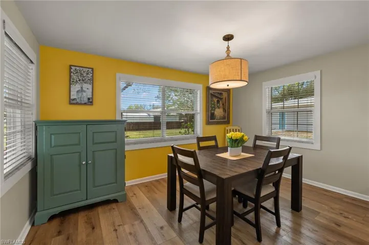 Dining space with light hardwood / wood-style flooring