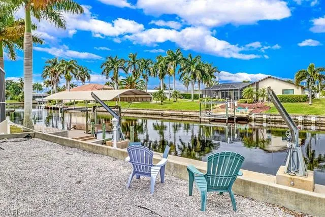 Dock area featuring a water view and boat lift