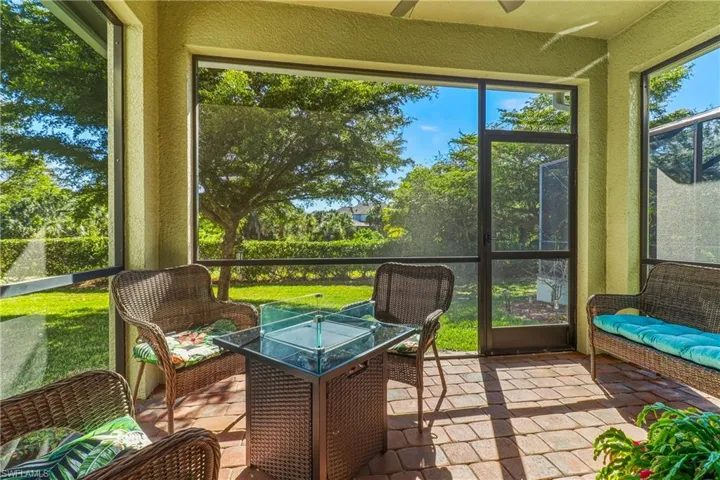 Sunroom / solarium with a ceiling fan and an outdoor hangout area