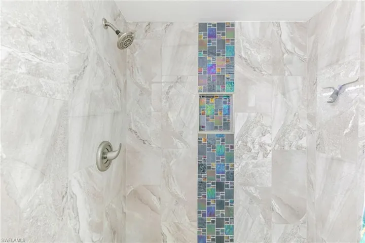 Bathroom featuring tiled shower