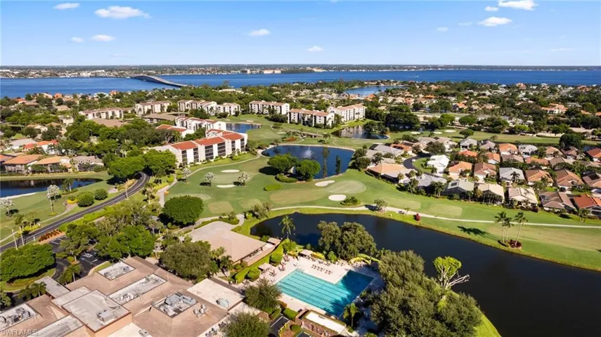 Birds eye view of property with a water view