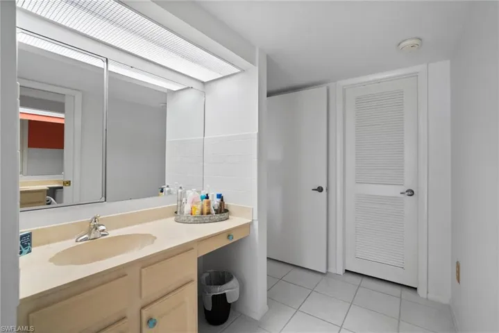 Bathroom featuring vanity and tile patterned floors