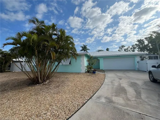 HOME EXTERIOR.  ZEROSCAPE LANDSCAPING.  2-CAR GARAGE W/AUTO LIFT.  METAL ROOF 2019.  FENCED.