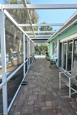 SPACIOUS SCREENED LANAI.  PAVERS.  SLIDING DOOR LEADS TO LIVING AREA.