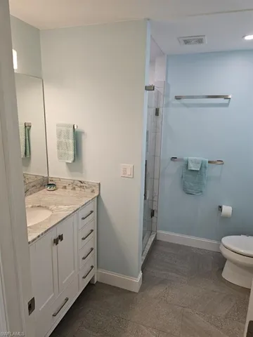 OWNER'S SUITE BATH.  GRANITE TOPEED VANITY W/UNDER-MOUNT SINK.  TILE FLOORING.