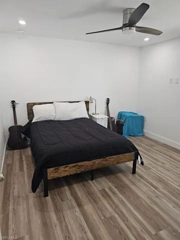 GUEST BEDROOM.  PLANK VINYL FLOORING.  RECESSED LIGHTING.  SLIDING IMPACT RESISTANT WINDOWS.