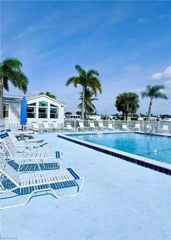 Community pool with a patio area
