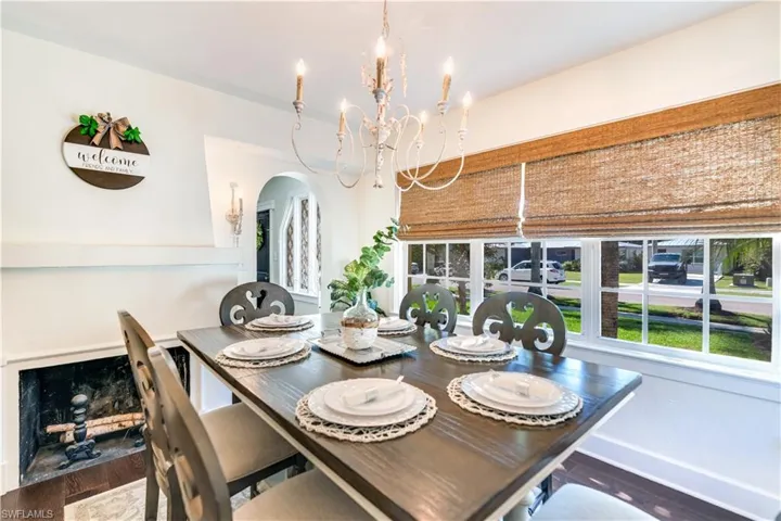 Dining area featuring hardwood / wood-style floors and a chandelier