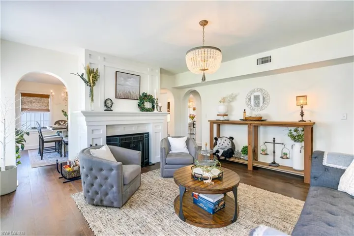 Living room featuring a chandelier and hardwood / wood-style floors