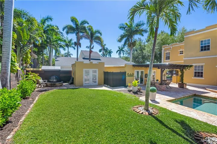Back of property with a patio, french doors, and a yard