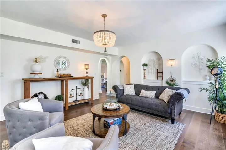 Living room featuring a chandelier and hardwood / wood-style floors