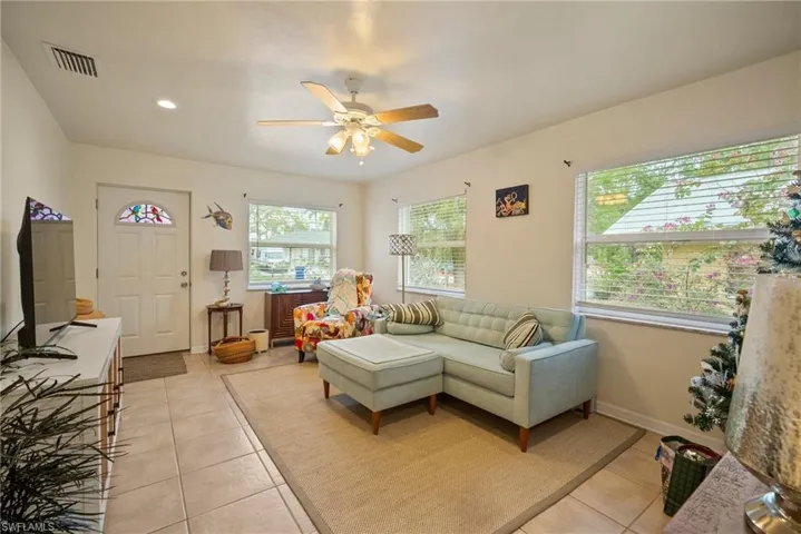 Tiled living room with ceiling fan