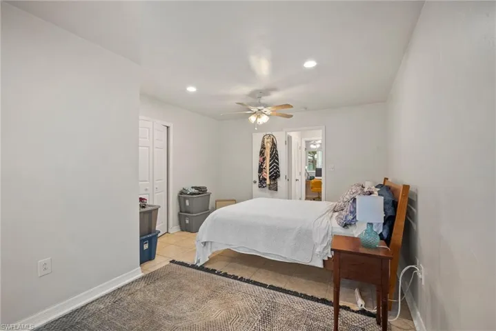 Bedroom featuring ceiling fan and light tile patterned floors