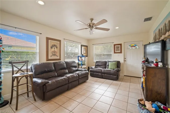 Tiled living room with ceiling fan