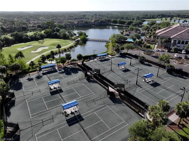 Drone / aerial view featuring a water view and golf course view