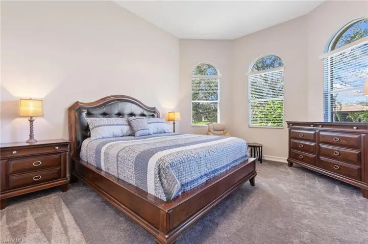 Carpeted bedroom with baseboards