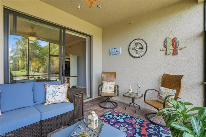 Sunroom / solarium with an outdoor lounge area and a patio area