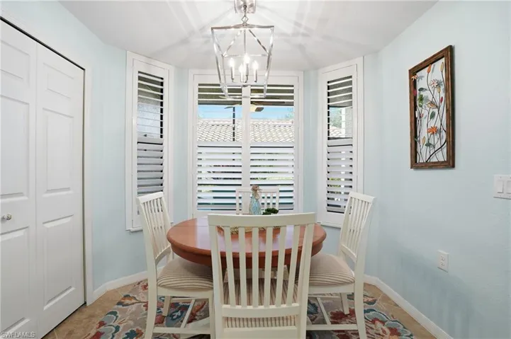 Dining area with suspended lighting and baseboards