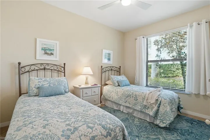 Bedroom with baseboards and ceiling fan