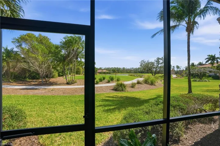 View of grassy yard with golf course view