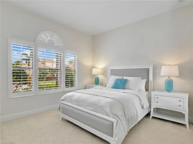 Carpeted bedroom with baseboards